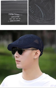 Detail of navy blue mesh beret with STYLING embroidery and adjustable metal buckle