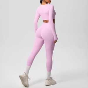 Detail of pink yoga set showing back contouring, high waist fit and premium matte texture