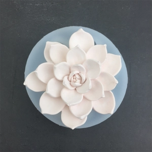 Pale pink succulent flower silicone mold for resin crafts and cake decoration on grey stone