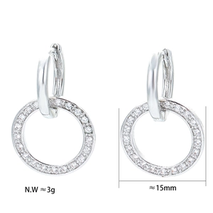 Detail view of small silver hoop earrings with clear zircon stones and size measurements