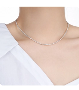 Detailed close-up of a S925 sterling silver necklace with irregular texture on model