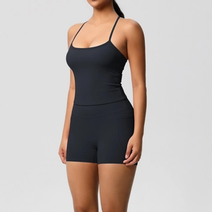 Detail of the high-stretch fabric and seamless stitching on the black yoga top and shorts