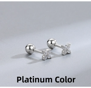 Macro view of S925 silver four-leaf clover screw-back earrings with sparkling zirconias