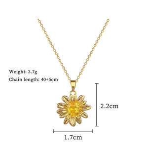 Detail view of champagne gold sunflower necklace with dimensions and 3.7g weight info