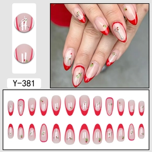 French red-tip almond press-on nails with retro cocktail and dot pattern art