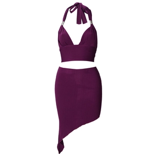 Deep purple two-piece set featuring a halter crop top and asymmetric ribbed mini skirt