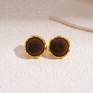 Close-up of vintage brown flocked geometric earrings with elegant golden metal borders
