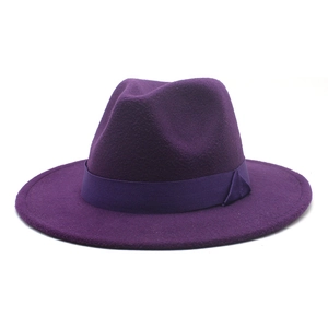 Detail of wool felt wide-brim fedora hat with matching grosgrain ribbon and side bow