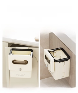 Wall-mounted folding trash can showing hook and adhesive installation for kitchen or bath