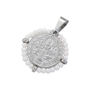 Detail of silver religious medallion with Virgin Mary relief and white pearl bead border