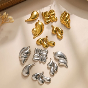 Polished 304 stainless steel pendants in gold and silver showing drop and wave shapes