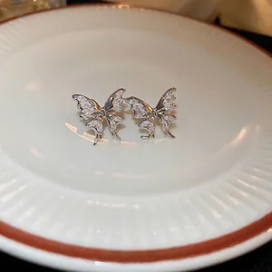 Sparkling zircon butterfly clip-on earrings in silver finish for non-pierced ears