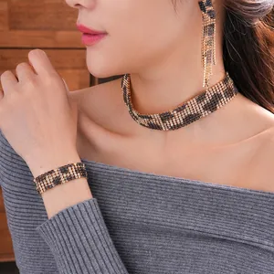 Leopard print rhinestone jewelry set including choker necklace, bracelet and tassel earrings