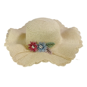 Women's straw sun hat with wavy brim and floral lace rhinestone accents for beach vacations