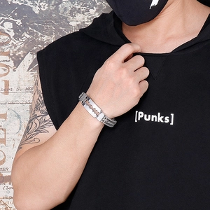 Close-up of punk style razor blade bracelet in silver stainless steel on male wrist