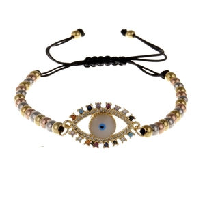 Detail of adjustable evil eye bracelet with colorful zircons and tricolor metal beads