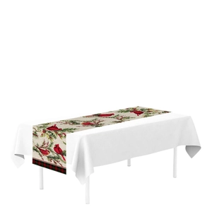 Christmas table runner with red cardinal and pine berry pattern on a white background