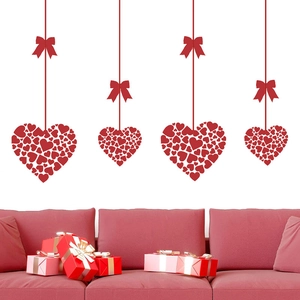 Pink and red heart window stickers with ribbons for Valentine's Day party atmosphere