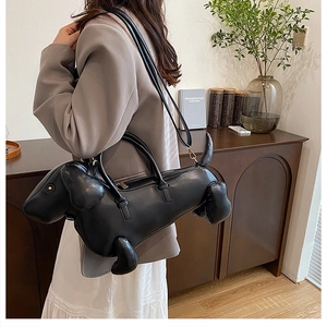 Creative black dachshund dog shaped handbag with leather texture and gold hardware