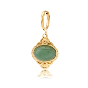 Detail of vintage gold oval earrings with green stone inlay and textured border