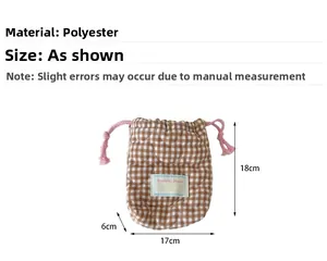 Close-up of brown checkered quilted camera pouch with dimensions and drawstring