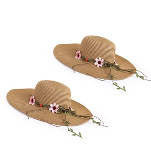 Women's wide brim woven straw sun hat with decorative floral vines and pink flowers