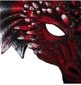 Macro detail of red and black dragon mask featuring realistic scales and sharp spikes