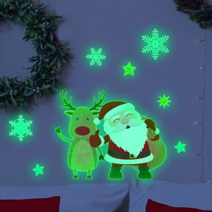 Stickers muraux de Noël phosphorescents Père Noël et rennes pour une décoration festive