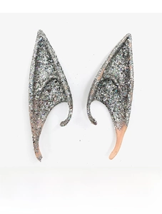 Close-up of silver glitter elf ears for Halloween cosplay with nude skin gradient finish