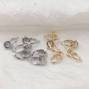 Macro view of gold and silver S925 sterling silver jewelry clasps for DIY pearl necklaces