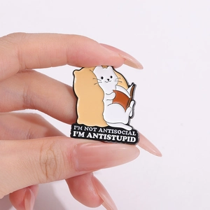 Funny white cat reading book enamel pin with I'm Not Antisocial quote in hand