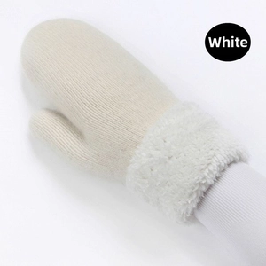 Close-up of white knitted mittens featuring thick faux fur cuffs for winter warmth