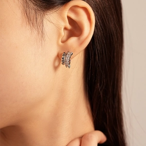 Silver-plated C-shaped double hoop earrings with pave cubic zirconia on female model