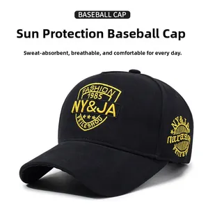Detailed view of yellow NY&JA embroidery on high-quality black cotton twill baseball cap