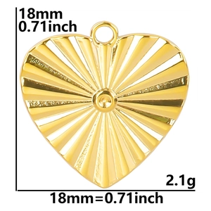 Detail view of 18mm gold heart pendant with 18k gold plating and sunburst texture