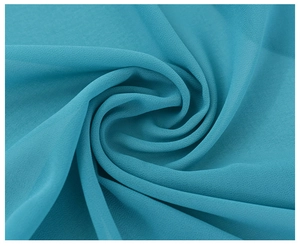 Macro view of blue chiffon hijab fabric showing smooth texture and layered folds