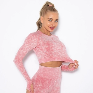 Pink acid wash seamless yoga set featuring long sleeve thumbhole top and leggings