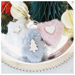 Detail of plush heart, star, and tree Christmas ornaments with gold glitter in a silver tray