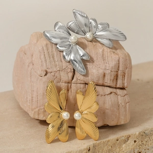 Elegant butterfly pearl earrings in gold and silver finish with radial texture pattern