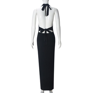 Detailed back view of a slim-fit black halter maxi dress with cutout tie-back design