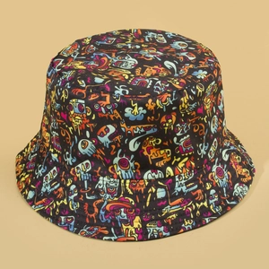 Black bucket hat with colorful graffiti monster prints shown at a 45-degree angle
