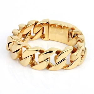Detail of gold Cuban link bracelet showing the large square clasp with stainless steel stamp