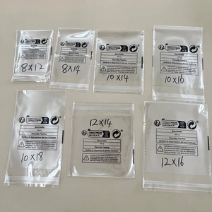 Detailed view of various sizes of transparent adhesive packaging bags with warning labels