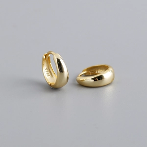 Macro detail of gold plated S925 sterling silver wide hoop earrings with hallmark
