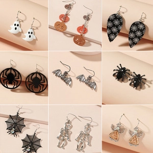 Detailed grid of Halloween earrings set featuring pumpkin, ghost, and spider motifs