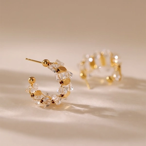 Elegant gold C-shaped hoop earrings with sparkling white zircon crystals and studs