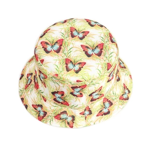 Detail of double-sided bucket hat featuring realistic butterfly prints and cotton canvas