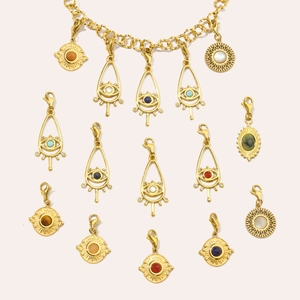 Detail view of gold stainless steel Evil Eye pendants with colorful natural stones
