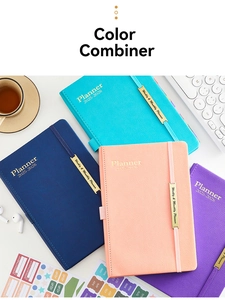Detailed flat lay of 2025-2026 faux leather planners with monthly index stickers