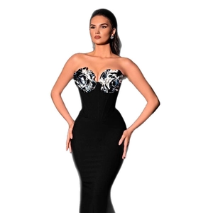 Elegant strapless black fishtail evening gown featuring 3D floral accents for formal events